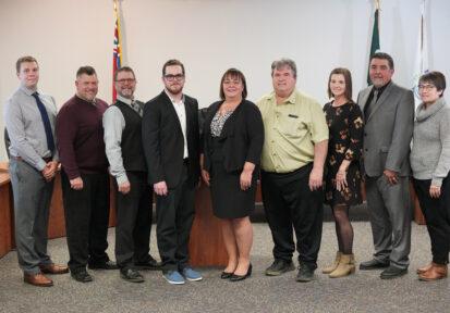 Municipal Council standing together in Council Chambers