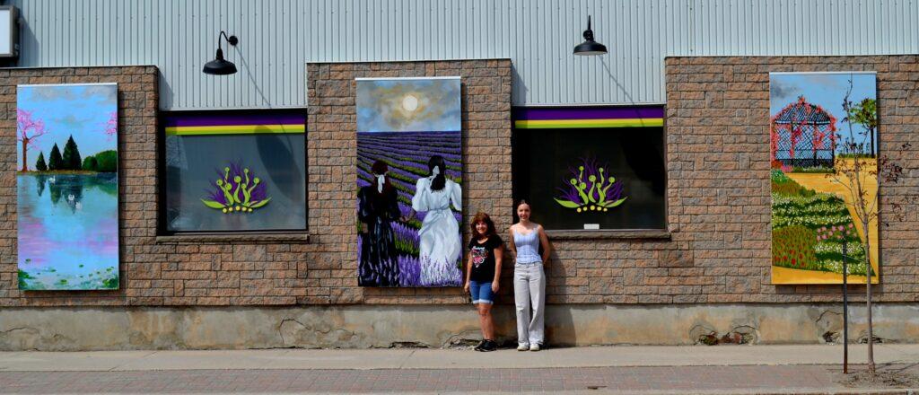 Artist with her mural